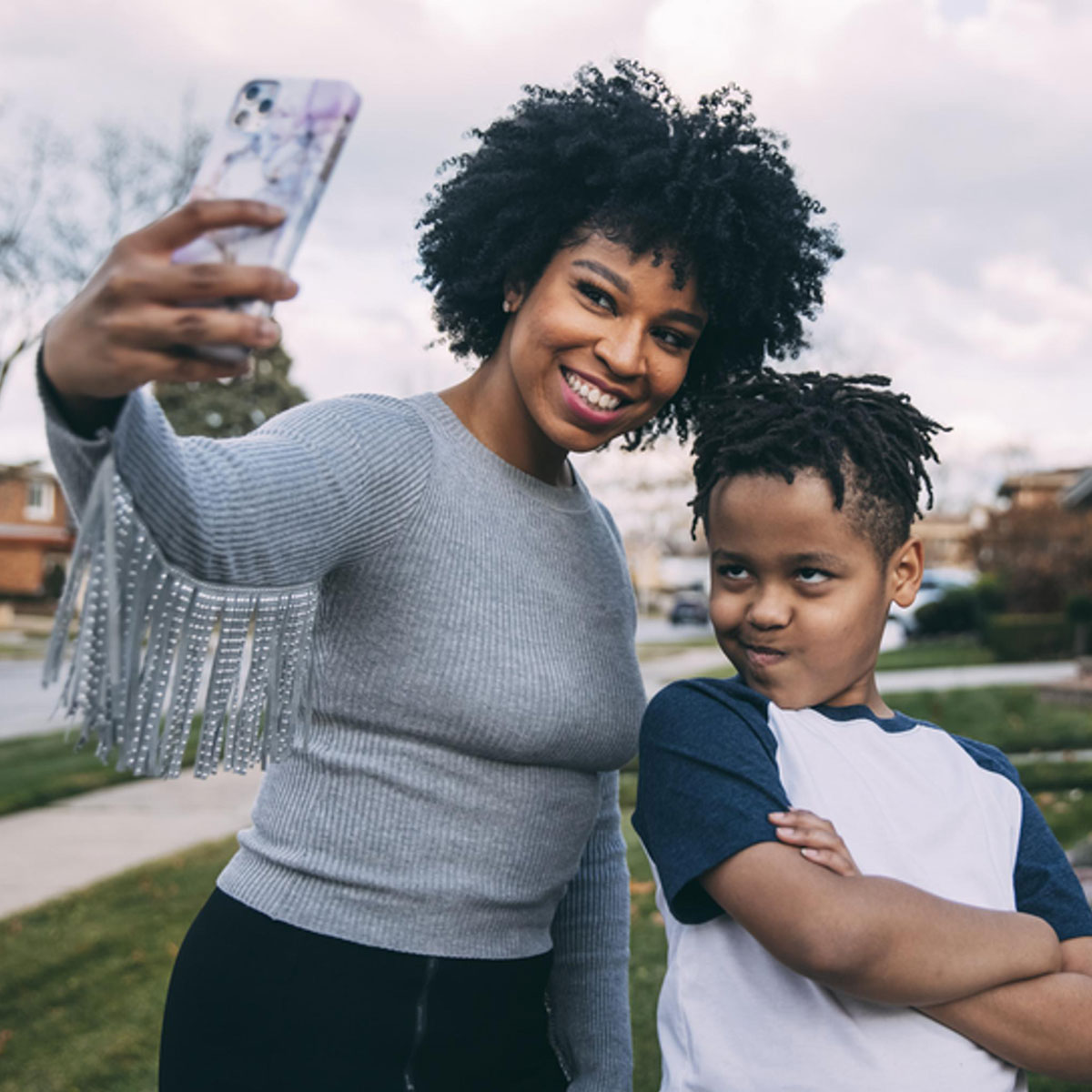 Woman taking selfie with child