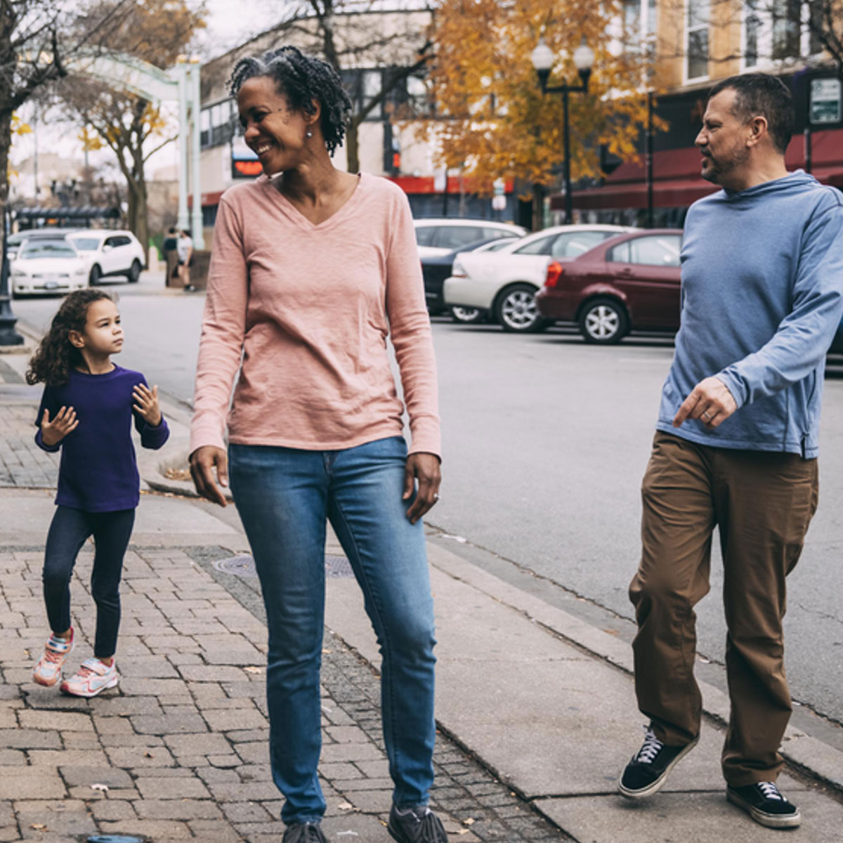 Family walking down the street together